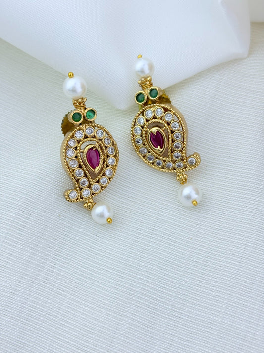 Premium matte finish mango pattern necklace crafted with classic AD stones and pearls