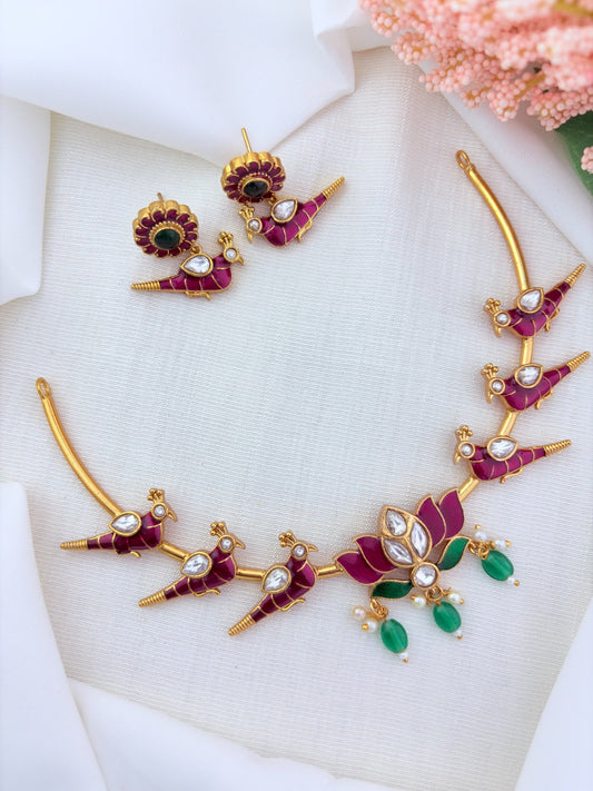 Peacock and lotus design combined in a single premium matte necklace with rich enamel detailing and matching earrings
