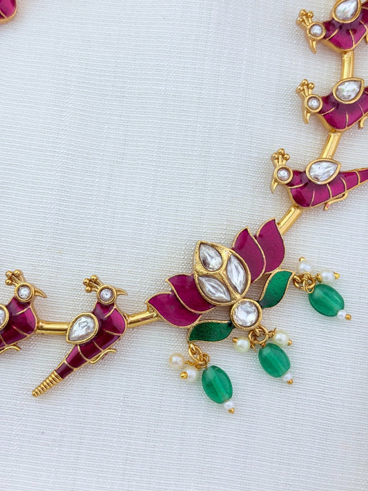 Peacock and lotus design combined in a single premium matte necklace with rich enamel detailing and matching earrings