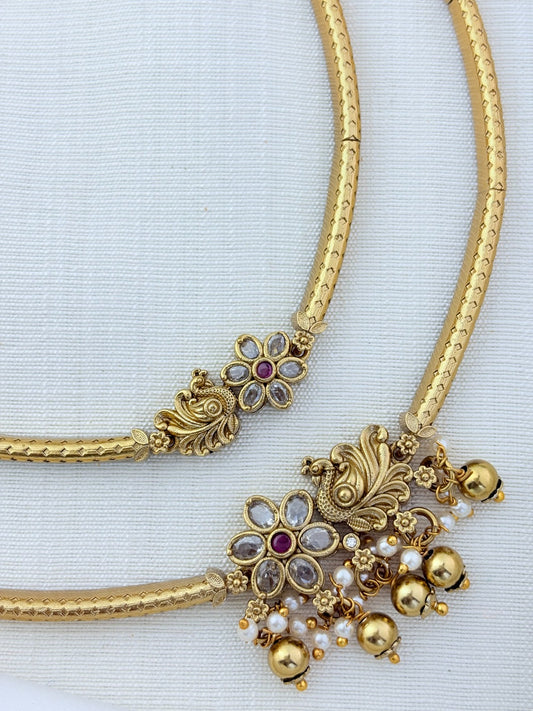 Classic layered necklace showcasing peacock and floral artistry, enriched with stones and highlighted pearl & gold drops
