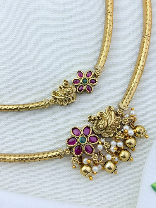 Classic layered necklace showcasing peacock and floral artistry, enriched with stones and highlighted pearl & gold drops