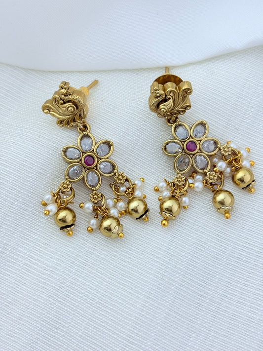 Classic layered necklace showcasing peacock and floral artistry, enriched with stones and highlighted pearl & gold drops