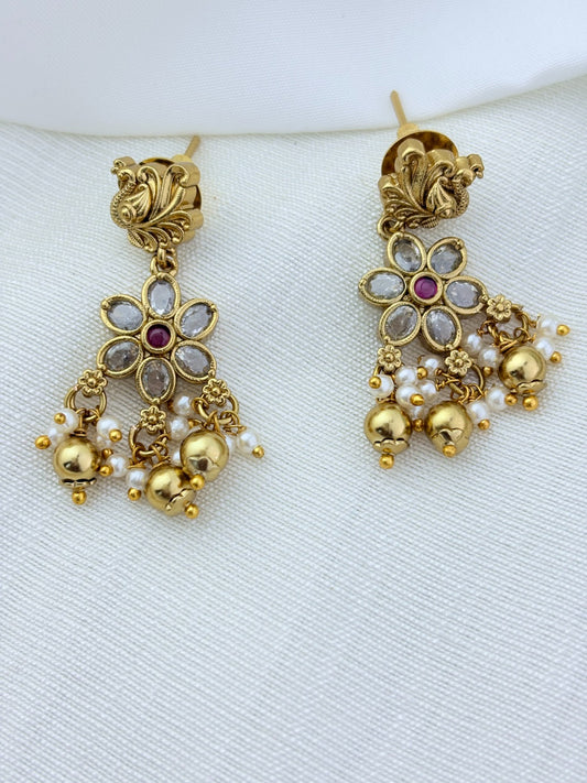 Classic layered necklace showcasing peacock and floral artistry, enriched with stones and highlighted pearl & gold drops