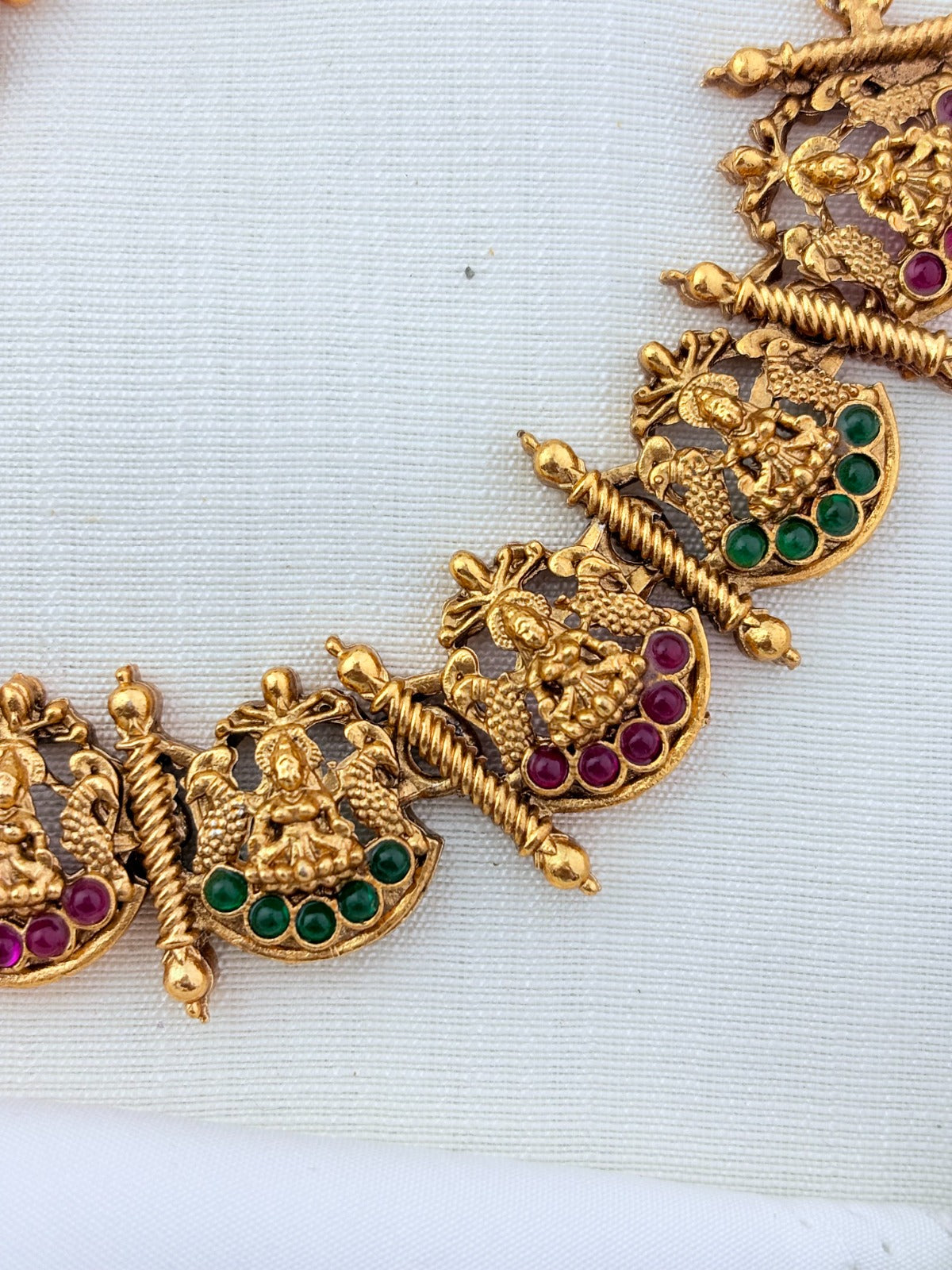 Matte finish Lakshmi choker and matching jumkha adorned with stones and golden beads