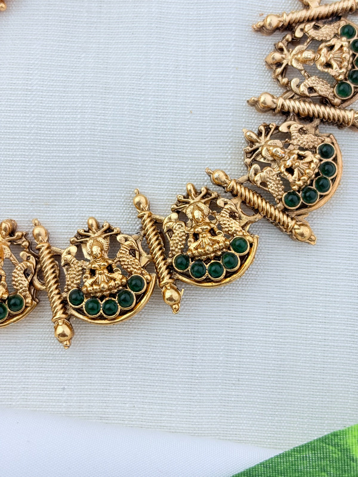 Matte finish Lakshmi choker and matching jumkha adorned with stones and golden beads