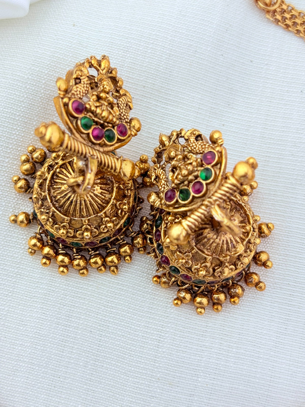 Matte finish Lakshmi choker and matching jumkha adorned with stones and golden beads