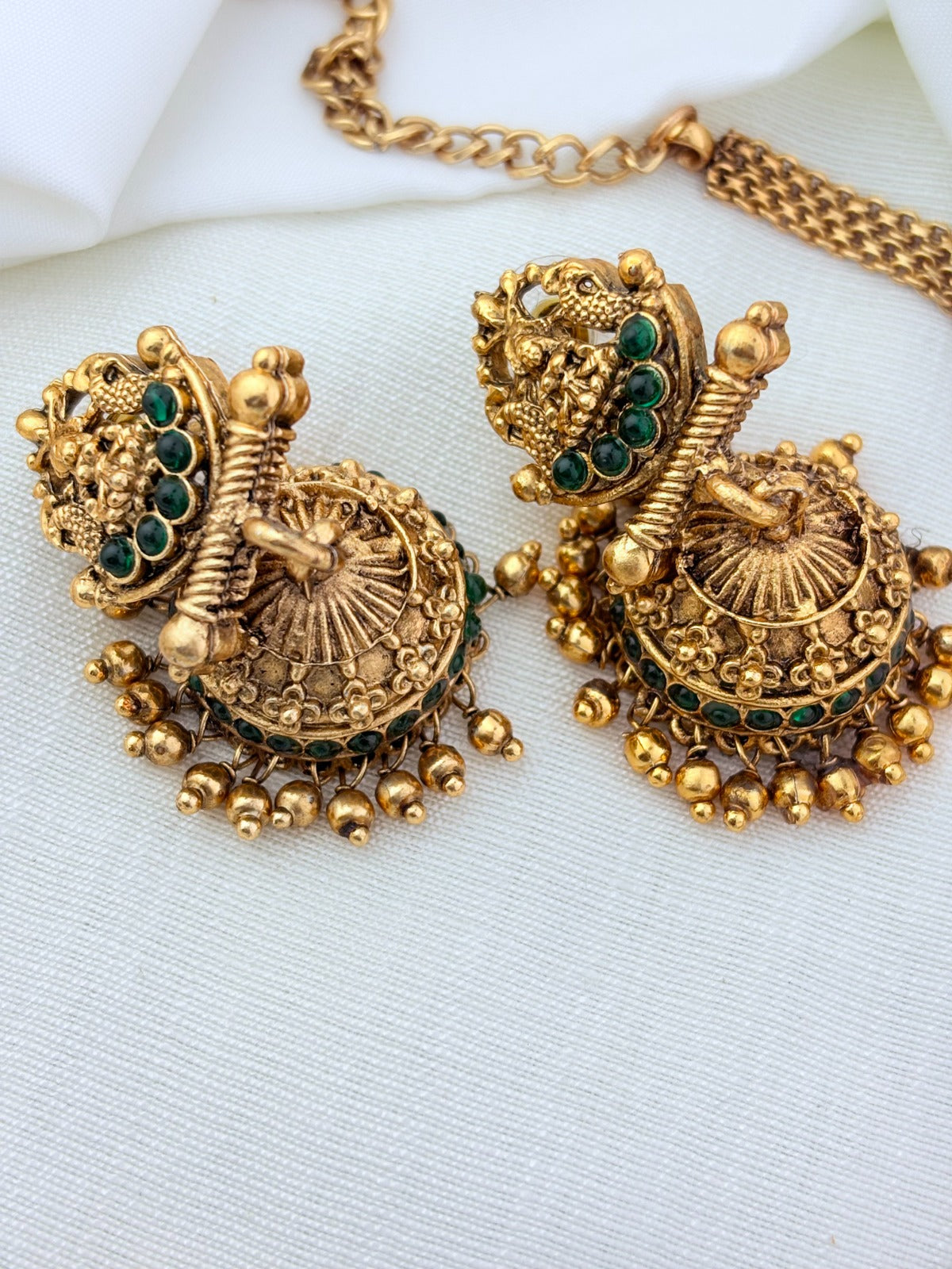 Matte finish Lakshmi choker and matching jumkha adorned with stones and golden beads