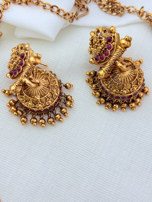 Matte finish Lakshmi choker and matching jumkha adorned with stones and golden beads