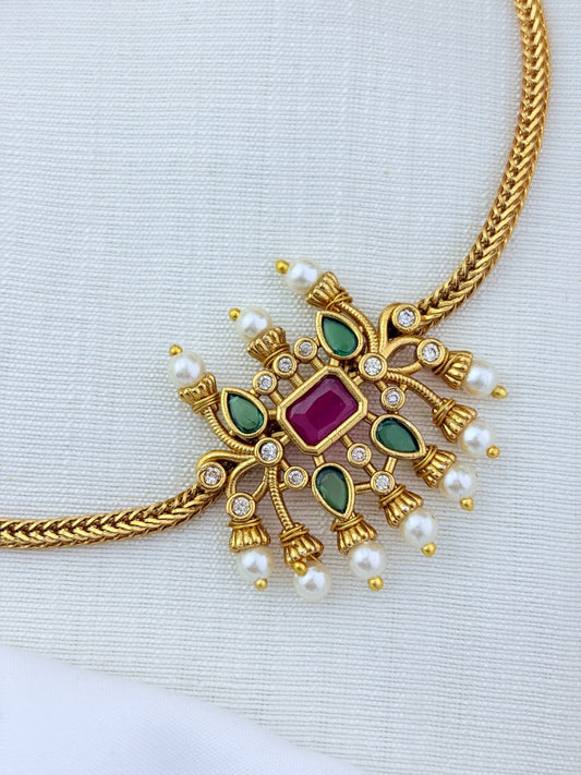 Traditional pattern  premium matte finish necklace and matching earrings crafted with stones and pearls