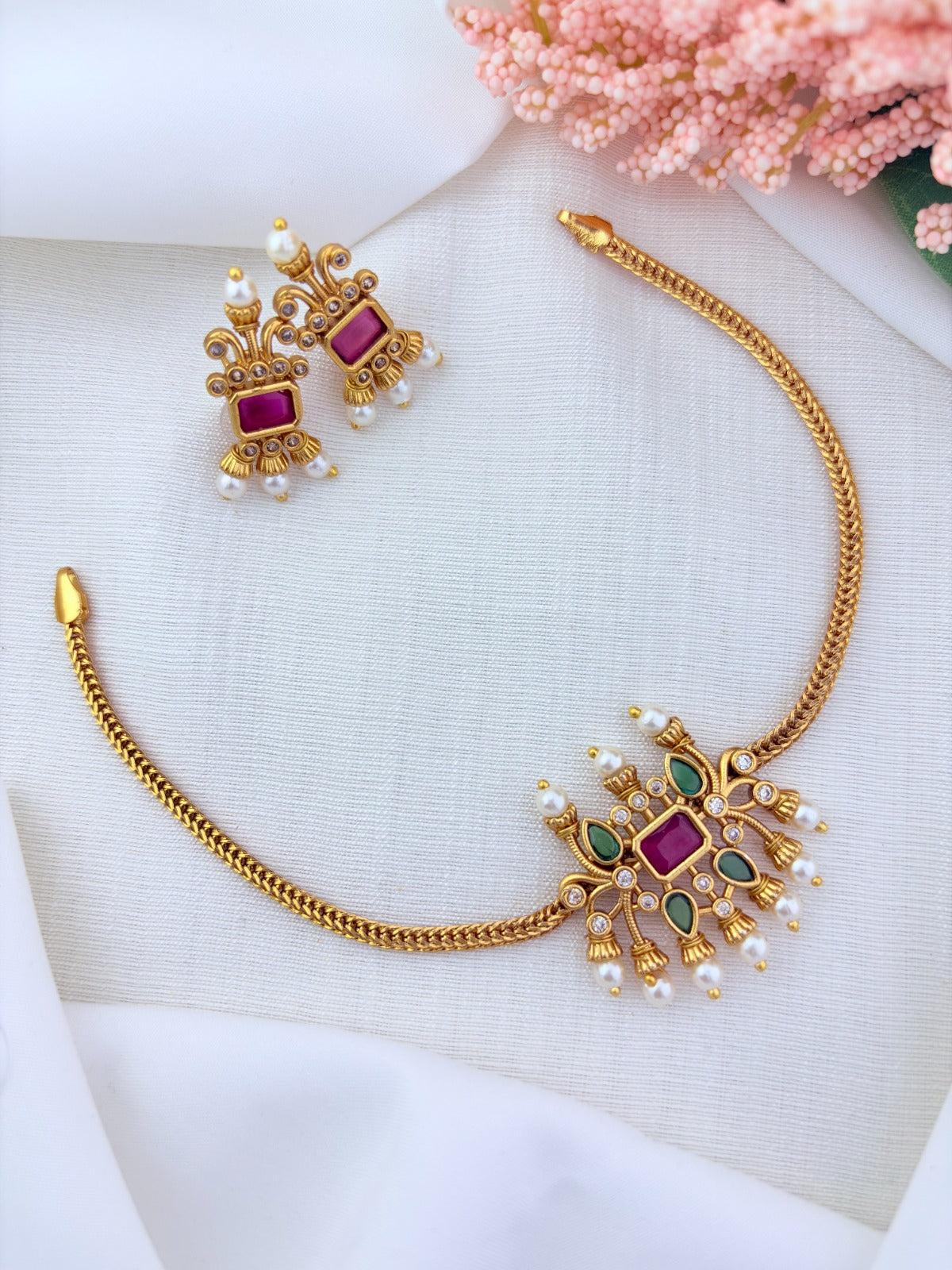 Traditional pattern  premium matte finish necklace and matching earrings crafted with stones and pearls