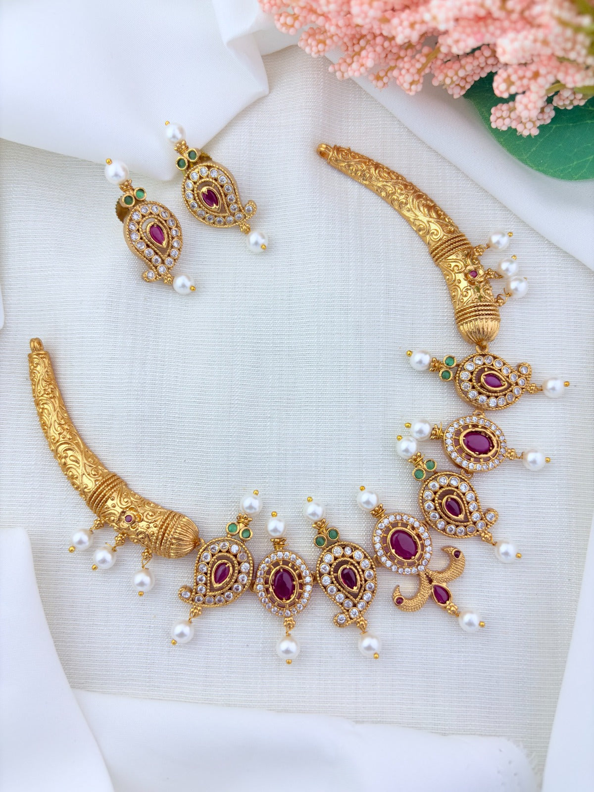 Premium matte finish mango pattern necklace crafted with classic AD stones and pearls