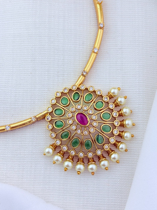 Premium matte finish necklace and earrings adorned with classic stones and pearls