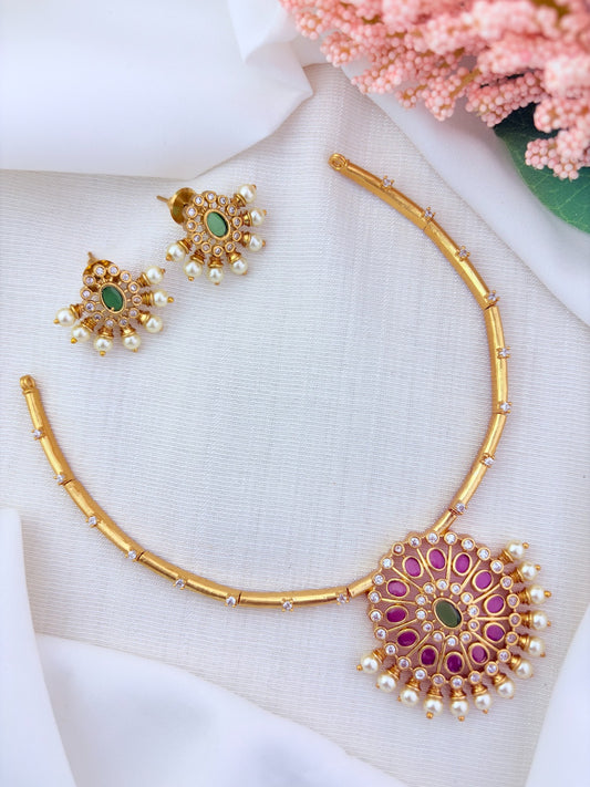 Premium matte finish necklace and earrings adorned with classic stones and pearls