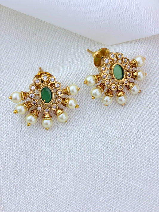 Premium matte finish necklace and earrings adorned with classic stones and pearls